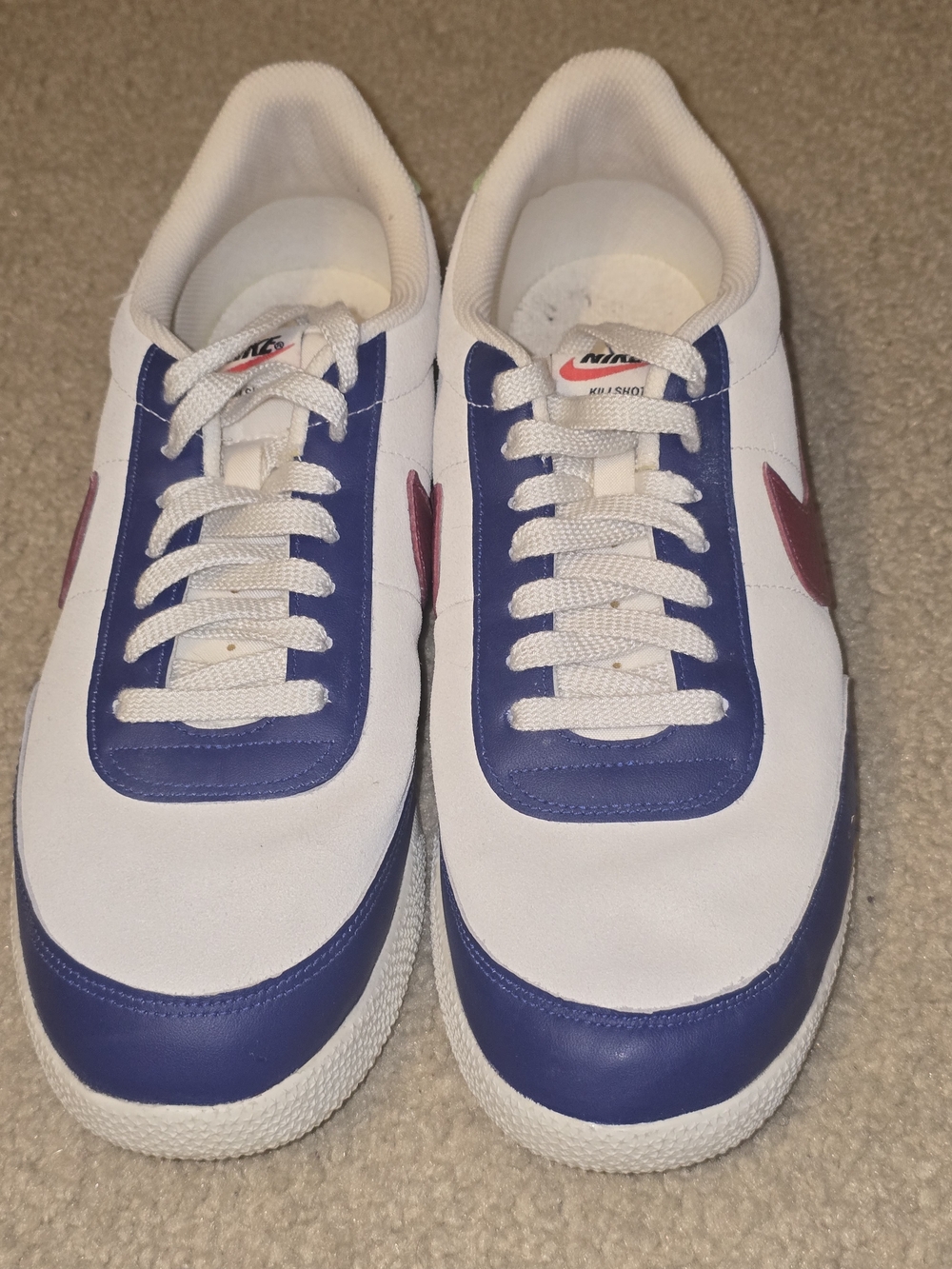Nike Men’s White Sneakers with Blue Overlays and Red Swoosh